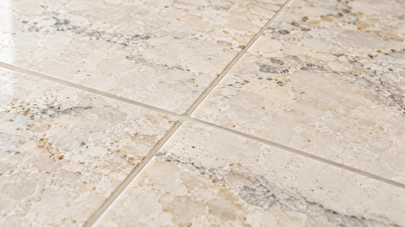 Close-up of polished marble slabs with a smooth, finished adhesive joint, illustrating the final appearance of bonded natural stone.